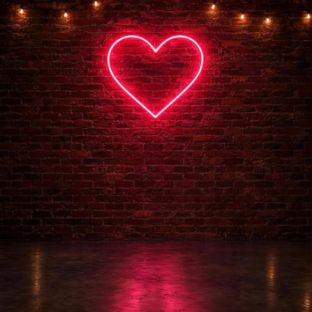 Fotohintergrund: Neonherz an Backsteinwand